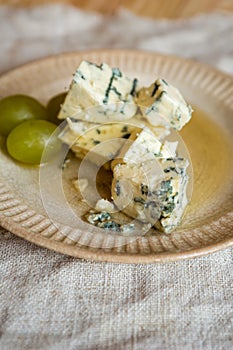 Blue mold cheese and grapes on a plate
