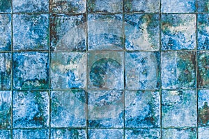 Blue mosaic ceramic tiles with abstract pattern texture background in modern interior