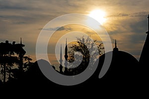 Blue mosque Sultan Ahmed Mosque. and Hagia Sophia shapes on sunset photo