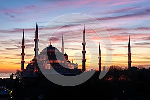 The Blue Mosque (Sultanahmet Camii) with illumination against the sunset.