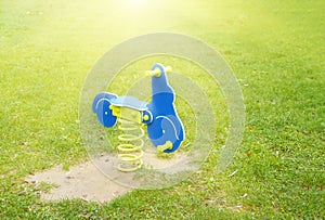 Blue motorcycle on the green grassy lawn