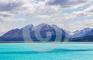 Blue Mountains over the lake with turquoise water. Lake Pukaki in the Southern Alps. New Zealand