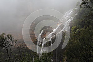 Blue Mountains and waterfall in heavy fog
