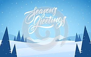 Blue mountains winter snowy landscape with pines and hand lettering of Season`s Greetings. Christmas card