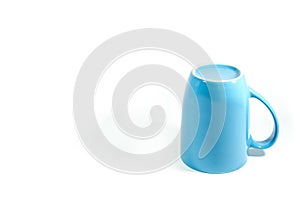 Blue mug upside down isolate on white background