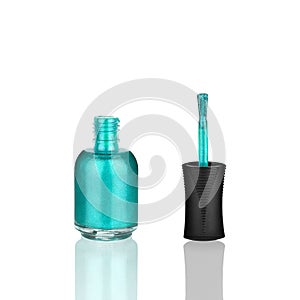 Blue nail polish glass bottle and brush, mirror reflection white background isolated close up, light blue open varnish, turquoise