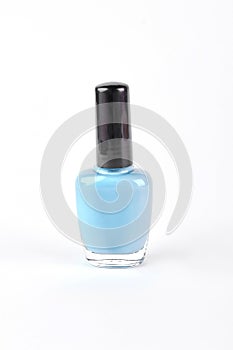 Blue nail polish on white background.