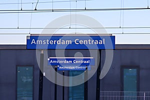 Blue name signs on the platforms at Amsterdam Central station