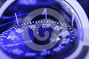 Blue nautical compass closeup focus on east