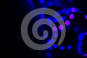 Blue neon blurry spiral led lights on black. Abstract background for your design