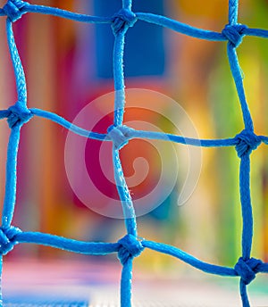 Blue net in children playground. Focus on net