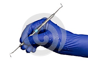 Blue Nitrile Gloved Hand with Dental Tool