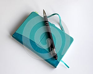 Blue notepad with pen