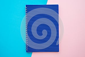 Blue notepad on pink blue background - Business education stationery