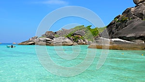 Blue Ocean Beach with Big Rocks, Turquoise Water and Greenery on Tropical Island