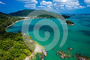 Blue ocean with a green shoreline and a mountain in the background, Pantai Kok, Langkawi,Malaysia