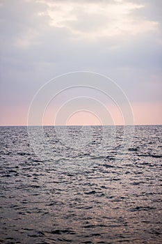 Blue ocean and pink sky with cloud before sunset in Sri Lanka