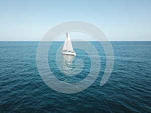 Boat in to the blue ocean photo