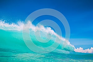 Blue ocean wave at tropical beach. Clear wave in tropics and blue sky