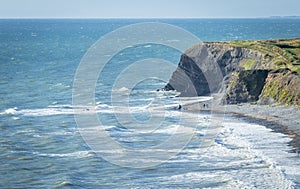 Blue Ocean Waves Crashing Against Scenic Shoreline