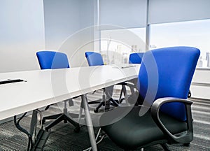 Blue office chair with backrest in meeting room for seating