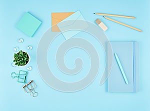 Blue office desktop. Top view of modern bright table with office supplies. Mock up, copy space