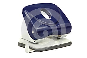 Blue office paper hole punch isolated on white background. Puncher for office paper on a white background.