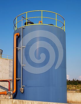 Blue oil storage tank