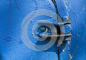 Blue old metal door hinge