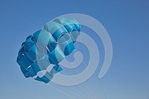 Blue open parachute for paragliding watersports