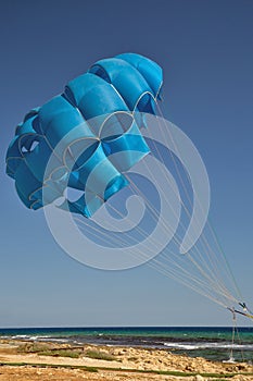 Blue open parachute for paragliding watersports