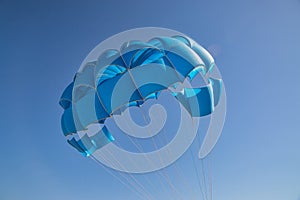 Blue open parachute for paragliding watersports