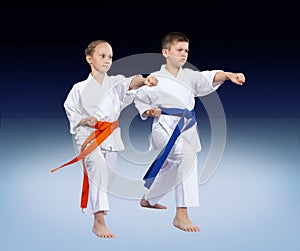 With blue and orange belt athletes are beating punch arm
