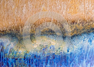 Blue and orange ceramic glaze background