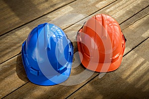 blue, orange hard safety helmet construction hat for safety project of workman as engineer or worker