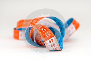 Blue and orange measuring tape