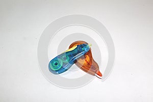 Blue and orange plastic correction tape isolated on white background