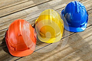 blue, orange, yellow hard safety helmet construction hat for safety project of workman as engineer or worker