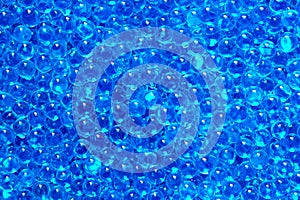 Blue orbiz in large numbers close up as a background