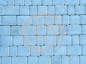 Blue outdoor stone block tile floor background and texture.