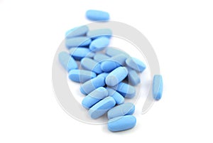 Blue oval tablets on white background