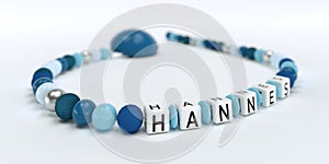 A blue pacifier chain for boys with name Hannes