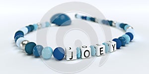 A blue pacifier chain for boys with name Joey