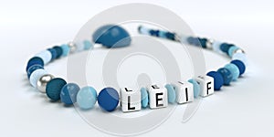 A blue pacifier chain for boys with name Leif