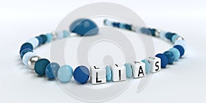 A blue pacifier chain for boys with name Lias