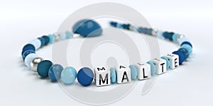 A blue pacifier chain for boys with name malte