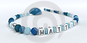 A blue pacifier chain for boys with name Mattis
