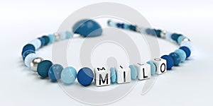 A blue pacifier chain for boys with name Milo