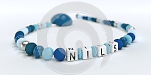 A blue pacifier chain for boys with name Nils