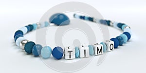 A blue pacifier chain for boys with name Timo